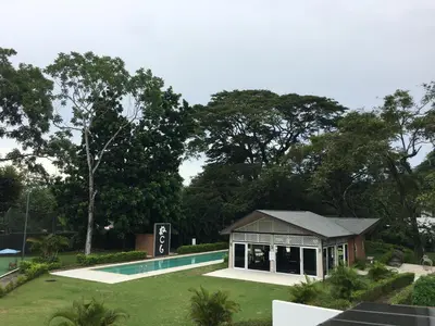 a house with a swimming pool in a yard at Villa Paraiso do Mar in Jacó