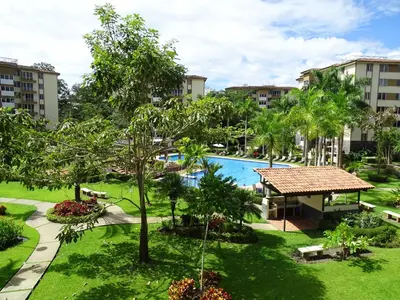 an aerial view of the courtyard of a resort at Paradise Jaco Beach Apartment in Jacó