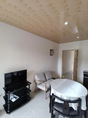 a living room with a couch and a table at Apartamentos La Paz in Liberia