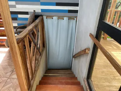 a staircase with a blue shower in a house at Casona La Vieja, Luz del Corazón in Rincón de la Cruz