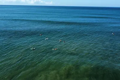 a group of people swimming in the water at Stunning House! Villa Kalapiti - Blue Zone Costa Rica in Delicias