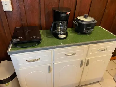 a counter with a coffee maker on top of it at Big Sloth Apartment in Fortuna