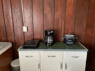 a counter with a coffee maker on top of it at Big Sloth Apartment in Fortuna
