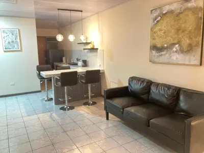 a living room with a couch and a table at Hospedaje Ana Lu 1 Only 10 minutes from airport in Alajuela City