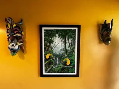 a picture on a wall with a mask on it at Casa Rio Blanco Eco Friendly B&B in Guápiles