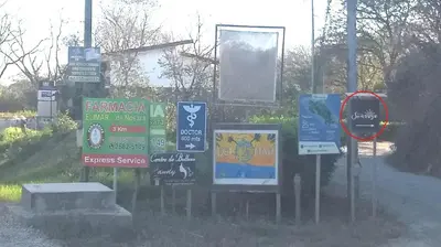 a bunch of signs on the side of a road at Nosara Sunrise Bed and Breakfast in Nosara