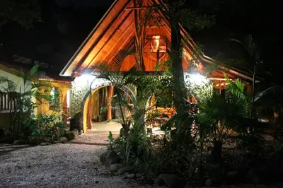 a house at night with lights on it at Nosara Sunrise Bed and Breakfast in Nosara