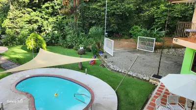 an overhead view of a backyard with a swimming pool at Yethan house in Uvita