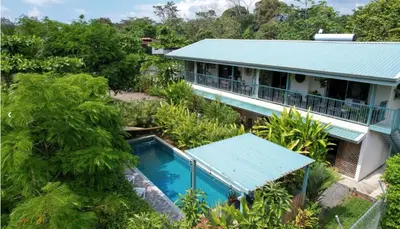 an aerial view of a house with a swimming pool at Lovely studio-apartment near the beach in Uvita