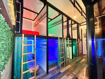 a room with colorful glass doors and a aquarium at Tucan Hotel in Uvita