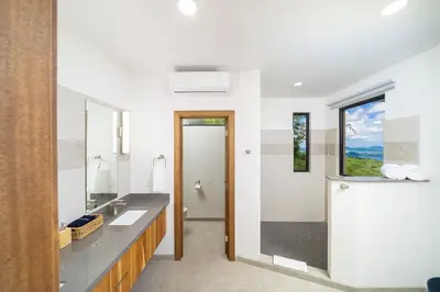 a bathroom with a sink and a mirror at Villa Vista Pacifico - Serene Villa, Ocean View Pool, Rooftop Deck, 5 BR in Potrero