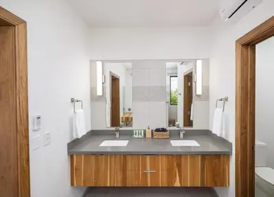 a bathroom with two sinks and a large mirror at Villa Vista Pacifico - Serene Villa, Ocean View Pool, Rooftop Deck, 5 BR in Potrero