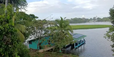 a house in the middle of a river at The Secret Eco Lodge in Tortuguero