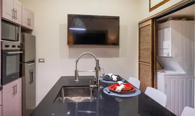 a kitchen with a sink and a counter top at Tamarindo Gem: 1BR Apt in Heart! in Tamarindo