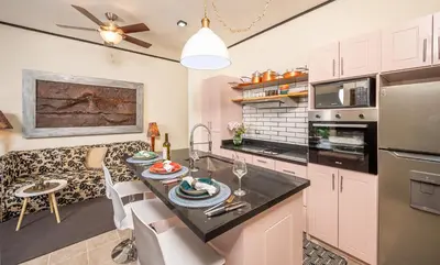a kitchen and dining room with a table and chairs at Tamarindo Gem: 1BR Apt in Heart! in Tamarindo
