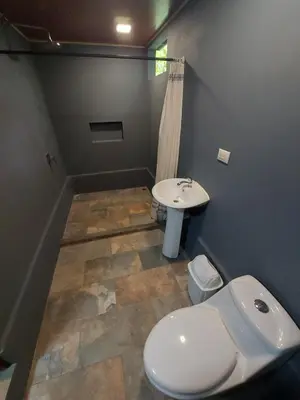 a bathroom with a toilet and a sink at Toku in Fortuna