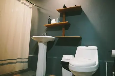 a bathroom with a toilet and a sink at Toku in Fortuna