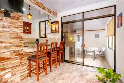 a kitchen and dining room with a table and chairs at Casa en Playa Tambor - A 5 minutos de la playa in Tambor