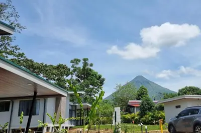 a car parked in front of a house with a mountain at Villas Töcu-Casa Perezoso in Fortuna