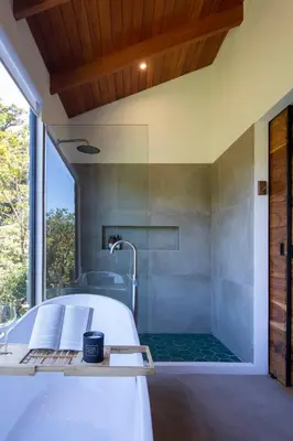a bathroom with a tub and a shower at Casas Jaguar in Monteverde Costa Rica