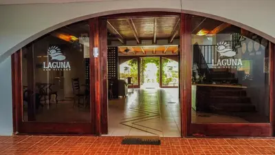 an entrance to a restaurant with glass doors at Cozy getaway w/pool-tennis-bbq near Manuel Antonio in Manuel Antonio