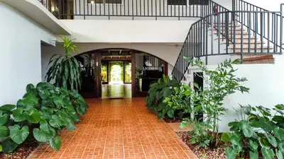 a hallway of a house with a staircase and plants at Cozy getaway w/pool-tennis-bbq near Manuel Antonio in Manuel Antonio