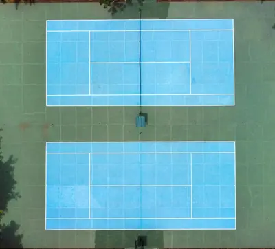 a tennis court with blue tiles on a wall at Cozy getaway w/pool-tennis-bbq near Manuel Antonio in Manuel Antonio