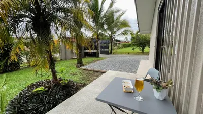 a table with two glasses of wine on a patio at Casa Bambu céntrico, lindo y acogedor con A C in General Viejo