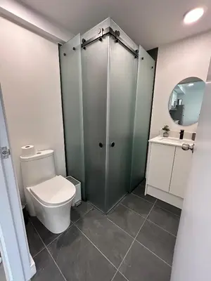 a bathroom with a toilet and a sink at COZY STUDIO near SABANA CENTRAL PARK in San José