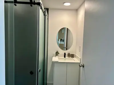 a bathroom with a sink and a mirror at COZY STUDIO near SABANA CENTRAL PARK in San José
