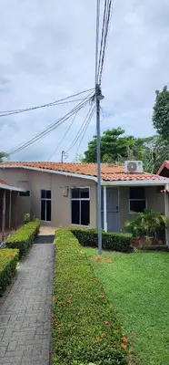 a house with a pole in front of it at Casa Yorba in Jacó