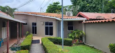 a house with a pathway leading to it at Casa Yorba in Jacó