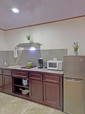 a kitchen with a microwave and a refrigerator at Monteverde Magic Mountain in Monteverde Costa Rica
