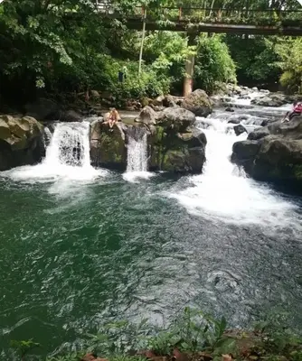a waterfall in the middle of a river at The Bees House in Fortuna