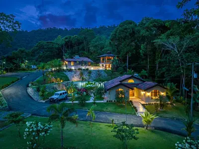 an aerial view of a house in the forest at night at The Garden Casitas by Vista Celestial in Uvita