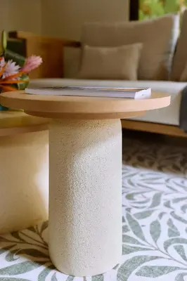 a table on top of a pedestal in a living room at The Garden Casitas by Vista Celestial in Uvita
