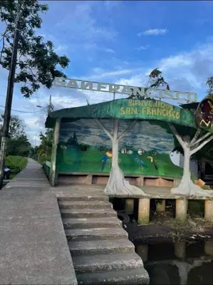 a building with a mural on the side of it at Tortuguero Hill Rooms in Tortuguero