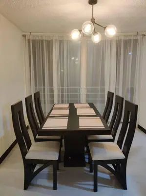 a dining room table and chairs in a room at Condo en Jacó in Jacó