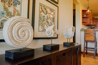 three vases on display on a table in a room at Spacious 2BR Condo with Ocean Glimpse - Jobo - Reserva Conchal Golf Resort in Playa Conchal