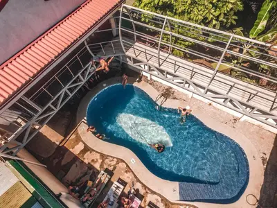 an overhead view of a swimming pool on a cruise ship at Hostel de Haan in Jacó