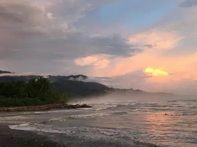 a view of a beach with the ocean and mountains at Uvita Oasis Retreat with Villa Apt Bungalows Cabin in Uvita