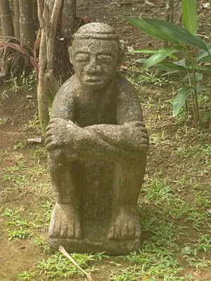 a statue of a stone statue of a person at Uvita Oasis Retreat with Villa Apt Bungalows Cabin in Uvita
