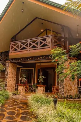 a building with a balcony on the side of it at Luxury Villa and Bungalows in Fortuna