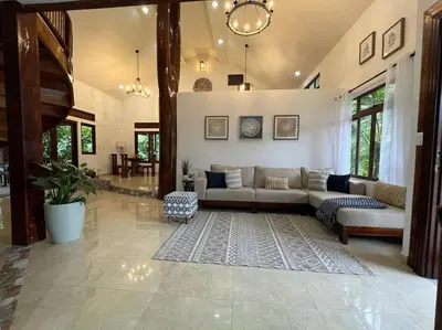 a living room with a couch and a rug at Luxury Villa and Bungalows in Fortuna
