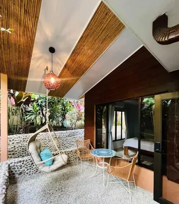 a living room with a swing and a bed at Luxury Villa and Bungalows in Fortuna