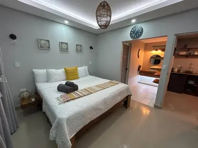 a bedroom with a large bed in a room at Luxury Villa and Bungalows in Fortuna