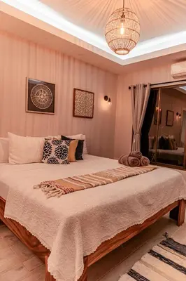 a bedroom with a large bed in a room at Luxury Villa and Bungalows in Fortuna
