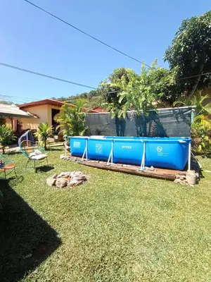 a yard with blue barriers in the grass at Casa Maranta in San Miguel