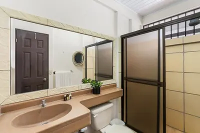 a bathroom with a sink and a mirror at Stunning Gated Property with a Lush Garden, Wrap-Around Terrace & Private Pool in Potrero