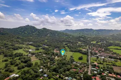an aerial view of a town with a kite in the air at Stunning Gated Property with a Lush Garden, Wrap-Around Terrace & Private Pool in Potrero